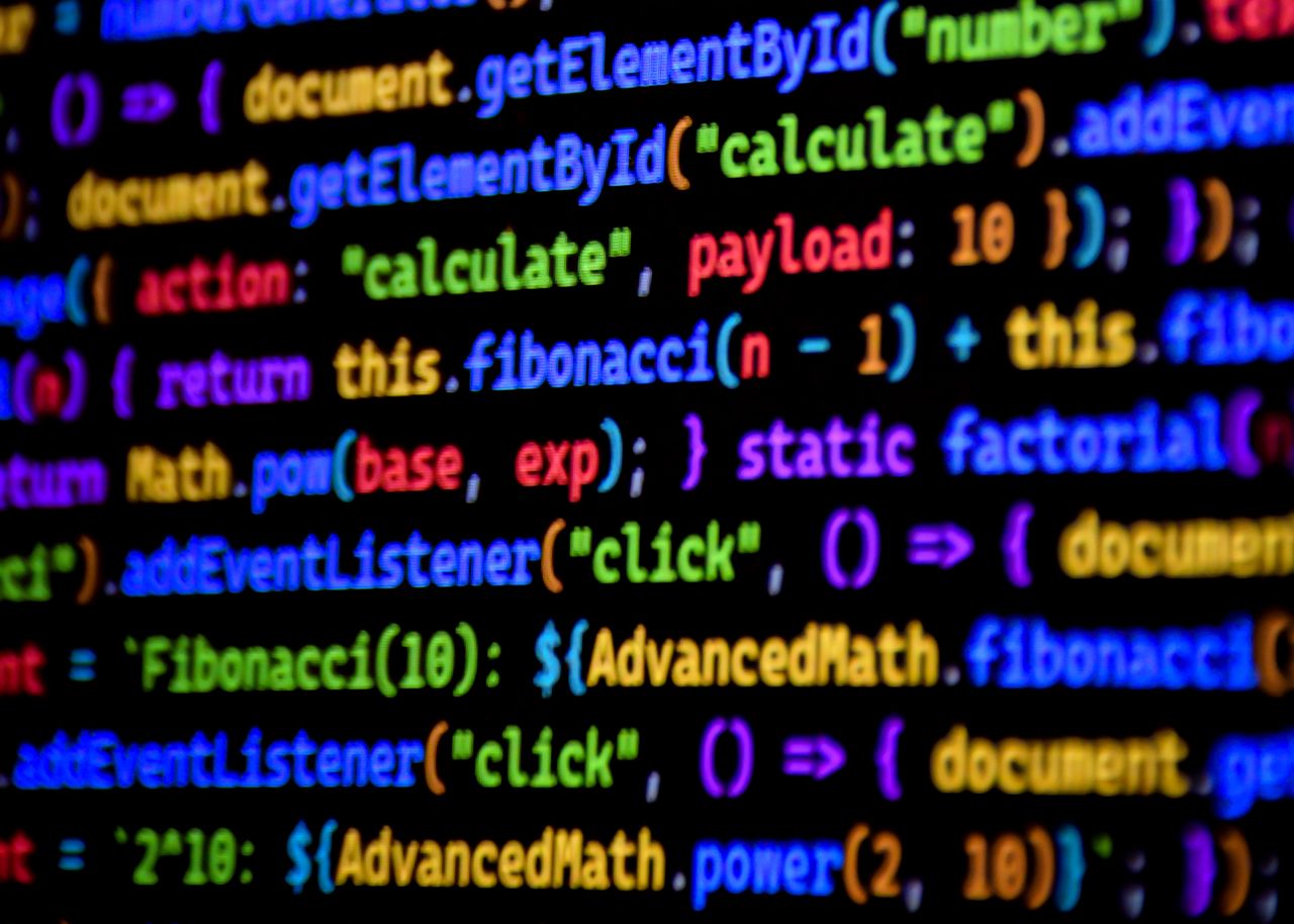 The Art of Drawing Readers In: Your attractive post title goes here Bright and colorful JavaScript code displayed on a computer screen, showcasing programming.